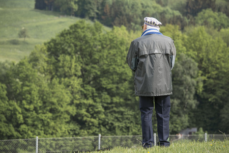 Mauthausen AustriaMay 10.2015: an exdeportee Observes the landscape around the camp of Mauthausen...