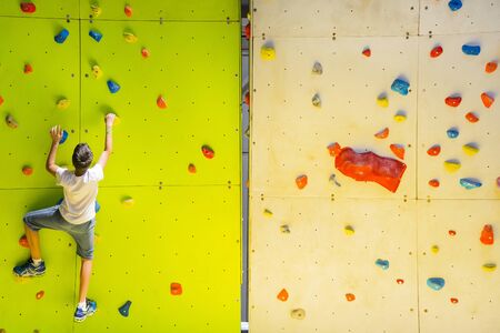Bologna,Italy-May 31,2015:an athlete climbing on an artificial wall for training during a cloudy dayのeditorial素材