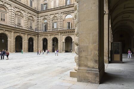 Florence, Italy-August 26.2014: Tourists walking and take pictures inside the Palazzo Pitti Pitti Palace During a cloudy day. The Palazzo Pitti is one of the landmarks in Florence and the point of access to the Boboli's gardens.のeditorial素材