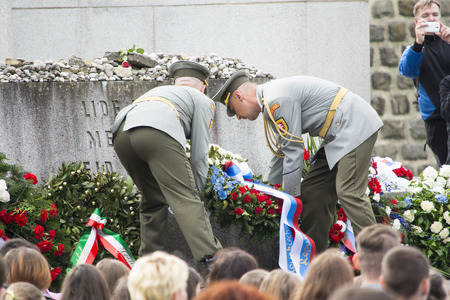 Mauthausen, Austria-May 10.2015: military celebration of the Mauthausen camp liberation by all the countries involved paying tribute to the fallen through military parades and floreal wreaths on monuments during a sunny day.のeditorial素材