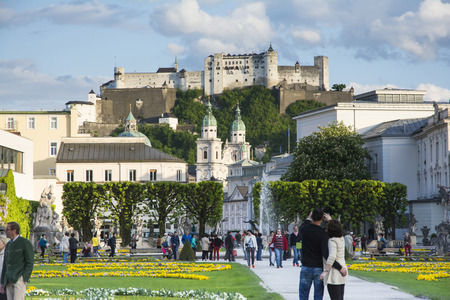 Salzburg,Austria-May 10,2015:people stroll and take photograph inside the famous Mirabell gardens in Salzburg during a sunny day.のeditorial素材