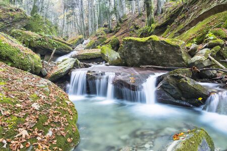 waterfalls inside the  casentinesi forest in Italy during a sunny autumn day.の写真素材