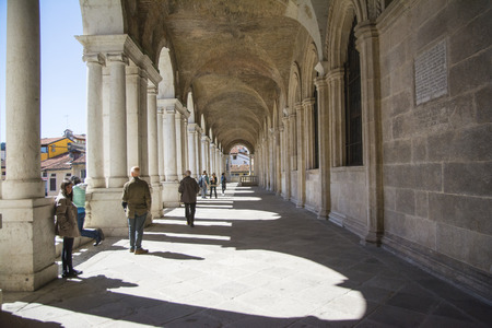 Vicenza,Italy-April 3,2015:people on  the  famous colonnade of the Palladian basilica in the center of Vicenza during a sunny day.のeditorial素材
