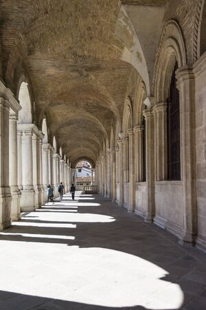 Vicenza,Italy-April 3,2015:people on  the  famous colonnade of the Palladian basilica in the center of Vicenza during a sunny day.のeditorial素材