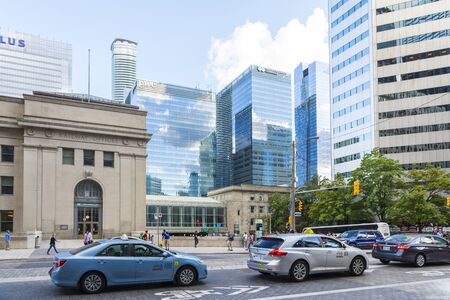 Toronto,Canada-august 1,2015:view of traffic and skyscrapers in Toronto during a sunny day from une of the central street of the city.のeditorial素材