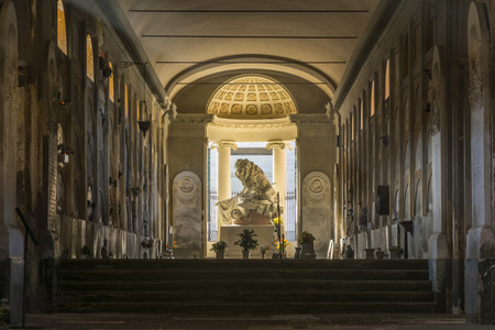Bologna,Italy-december 7,2016:Old statue of giant lion inside the monumental cemetery of the Certosa di Bologna during a sunny day.のeditorial素材