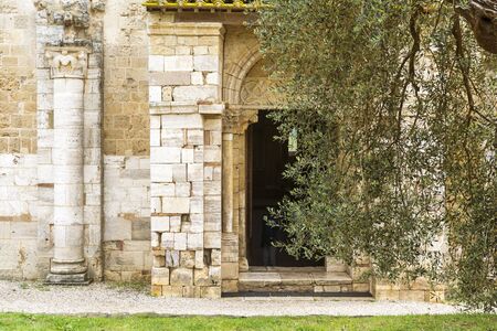 Pienza,Italy-April 24,2016:Main entrance of the saint Antimo Abbey in Tuscany-Italy during a cloudy day.のeditorial素材