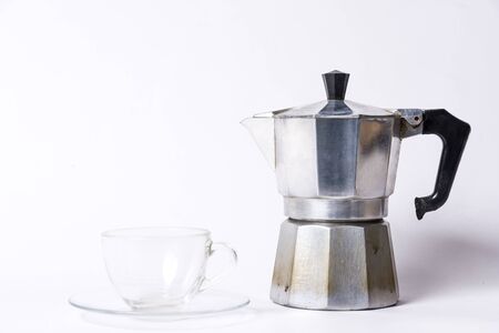 Italian coffee maker and an empty coffee cup on a white backgroundのeditorial素材
