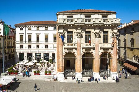 Vicenza,Italy-April 3,2015:people stroll in front of the Capitaniato  lodge in the Vicenza town square .during a sunny day.のeditorial素材