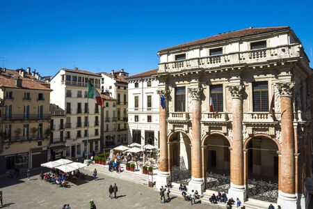 Vicenza,Italy-April 3,2015:people stroll in front of the Capitaniato  lodge in the Vicenza town square .during a sunny day.のeditorial素材