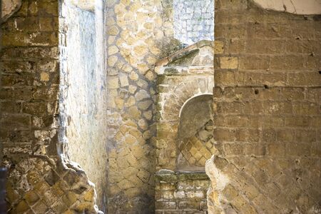 Ercolano, Italy- March 26, 2016: Columns and ruins inside the Herculaneum archeological site near Naples during a summer day.のeditorial素材