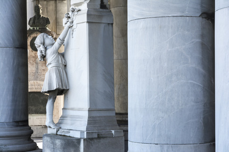 Bologna,Italy-december 12,2016:Old tomb   inside the monumental cemetery of the Certosa di Bologna during a sunny day.のeditorial素材