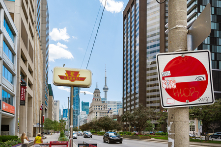 Toronto,Canada-august 3,2015:Urban view  near the CN tower in Toronto during a sunny day from one of the central street of the cityのeditorial素材