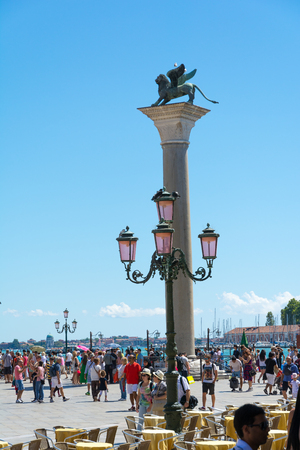 Venice,Italy -August 17,2014:Tourists visiting the famous Piazza San Marco in Venice during a sunny dayのeditorial素材