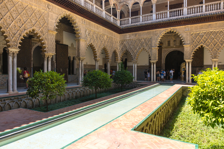 Seville,Spain-August 8,2017:People visit the Royal Alcazar of Seville during a sunny day.のeditorial素材