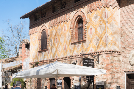 Piacenza,Italy-April 2,2018:People visit the historical village of Grazzano Visconti,neo-gothic village near Piacenza, Italy during a sunny dayのeditorial素材