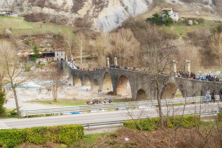 Bobbio,Italy-april 2,2018:View of the old medieval bridge, called 'Ponte Gobbo' over the river Trebbia in the small town of Bobbio.のeditorial素材