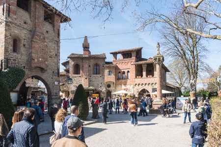 Piacenza,Italy-April 2,2018:People visit the historical village of Grazzano Visconti,neo-gothic village near Piacenza, Italy during a sunny dayのeditorial素材