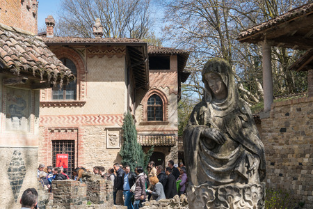 Grazzano Visconti,Italy-April 2,2018:People visit the historical village of Grazzano Visconti,neo-gothic village near Piacenza, Italy during a sunny dayのeditorial素材