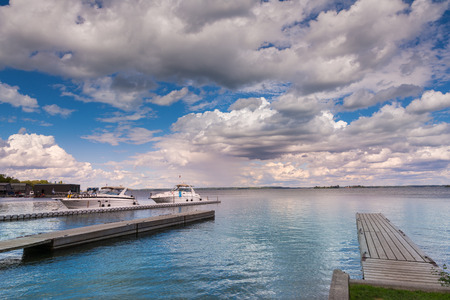 Thousan islands,Canada-august 4,2015:moored boats of the St. Lawrence River in One thousen islands national park in Ontario during a summer dayのeditorial素材