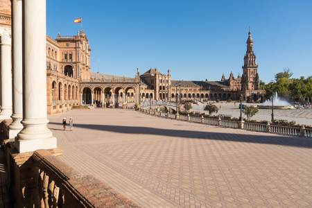 Seville,Spain-august 8,2017:tourists stroll and admire the famous plaza de Espana in Seville during a sunny dayのeditorial素材