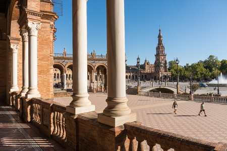 Seville,Spain-august 8,2017:tourists stroll and admire the famous plaza de Espana in Seville during a sunny dayのeditorial素材