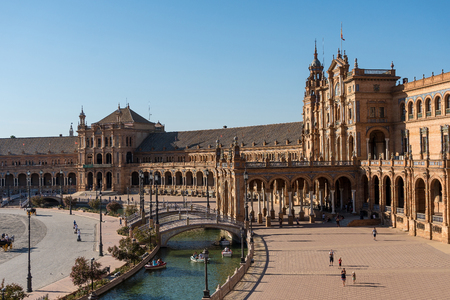 Seville,Spain-august 8,2017:tourists stroll and admire the famous plaza de Espana in Seville during a sunny dayのeditorial素材