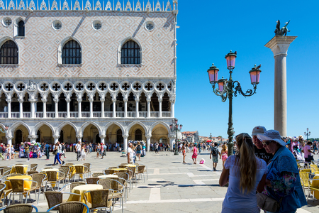 Venice,Italy -August 17,2014:Tourists visiting the famous Piazza San Marco in Venice during a sunny dayのeditorial素材