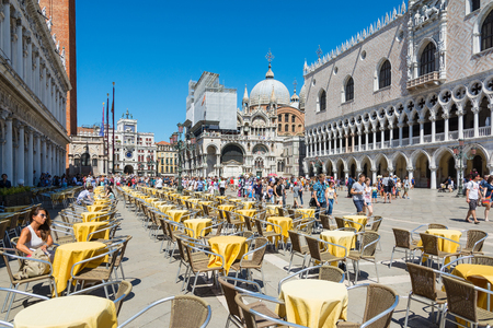Venice,Italy -August 17,2014:Tourists visiting the famous Piazza San Marco in Venice during a sunny dayのeditorial素材