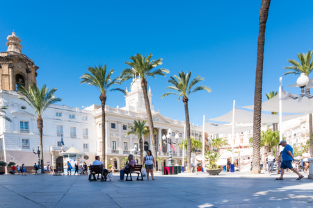 Cadiz,Spain-august 9, 2018:people stroll through the narrow streets of Cadiz on a sunny dayのeditorial素材