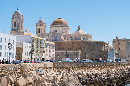 Cadiz,Spain-august 9, 2018:seafront promenade of Cadiz with the cathedral view during a sunny dayのeditorial素材