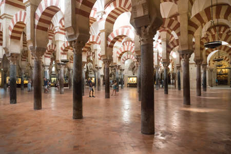 Cordoba,Spain-august 11, 2017:people admire the columns inside the beautiful Mezquita of Cordobaのeditorial素材