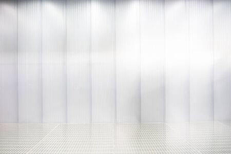 Grated steel wall and flooring with neon lightsの写真素材
