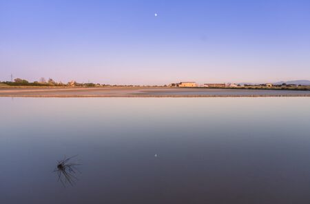 Walk through the famous saltern of Cervia-Italy during the eveningの写真素材