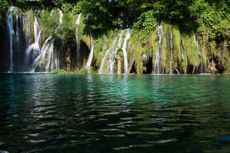 waterfall anf tree in the national park of plitvice lakes in croatia on a sunny dayのeditorial素材