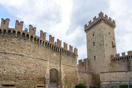 Vigoleno,Italy- July 22, 2018:View of the city walls and the entrance of Vigoleno, one of the most beautiful villages in Italy during a cloudy day.のeditorial素材