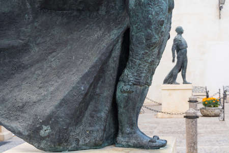 Ronda,Spain-august 10, 2017:view of a detail of the statues in front of the Plaza de toros in Ronda during a cloudy dayのeditorial素材