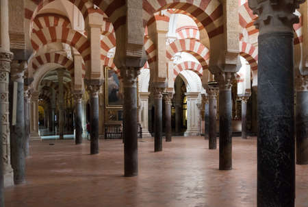 Cordoba, Spain-august 11, 2017: people admire the columns inside the beautiful Mezquita of Cordobaのeditorial素材