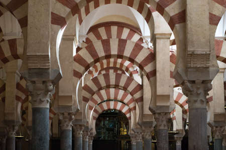 Cordoba, Spain-august 11, 2017: people admire the columns inside the beautiful Mezquita of Cordobaのeditorial素材