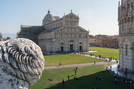 Pisa, Italy-October 21, 2018: view of the famous leaning tower and the medieval cathedral located in the famous square of miracles in Pisaのeditorial素材