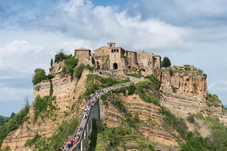 Civita di Bagnoregio, Italy-april 30,2018: people visit Civita di Bagnoregio during a sunny day.Defined "the dying city" because it was built on a tuff spurのeditorial素材