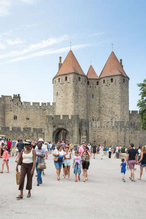Carcassonne, France-august 15,2016: people visit the famous fortified medieval city of Carcassone during a sunny dayのeditorial素材