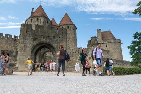 Carcassonne, France-august 15,2016: people visit the famous fortified medieval city of Carcassone during a sunny dayのeditorial素材
