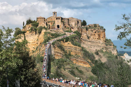 Civita di Bagnoregio, Italy-april 30,2018: people visit Civita di Bagnoregio during a sunny day.Defined "the dying city" because it was built on a tuff spurのeditorial素材