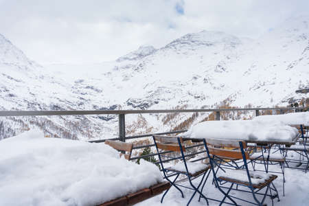 landscape from the trainstation of Alp Grum along the way of the red train of the bernina during a cloudy day.の写真素材