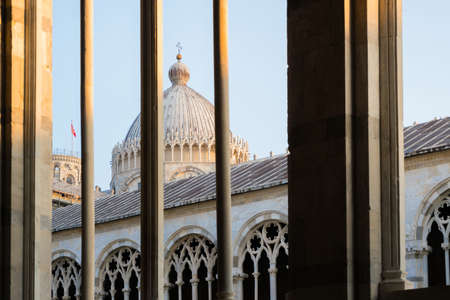Pisa, Italy-October 21, 2018: Strolling inside the cemetery of Pisa, in the famous Piazza dei Miracoli during the sunsetのeditorial素材