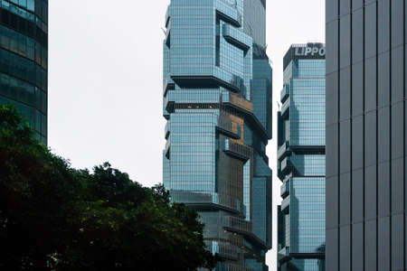 Hong Kong, March 24,2019: Strolling among the skyscrapers through the streets of Hong Kong during a cloudy dayのeditorial素材