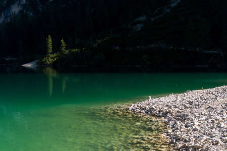 Braies, Italy-September 10, 2021: view of the Braies lake in the province of Bolzano admires the mountains that surround him during a sunny dayのeditorial素材