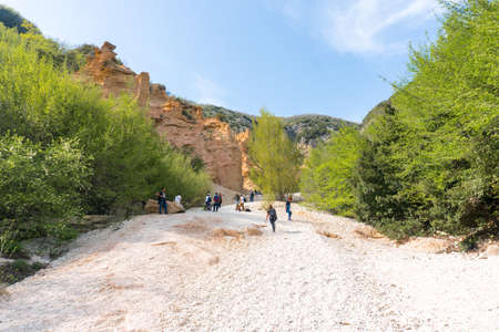 Fiastre, Italy-april 25, 2019: people on the trail to admire the canyon of the red blades which is located near Fiastre in the Marche region during a sunny dayのeditorial素材