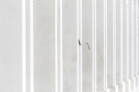 Tresigallo, Italy-may 2, 2021: detail of the porch in Tresigallo during a cloudy dayの写真素材